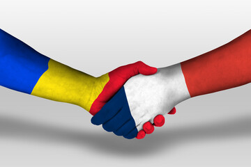 Handshake between france and romania flags painted on hands, illustration with clipping path.