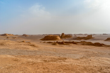 Fototapeta na wymiar Iran, In the Kalut Shahdad Desert Hottest place on earth. Sand and rock formations 