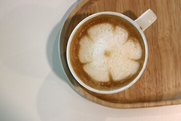 cup of hot latte art coffee