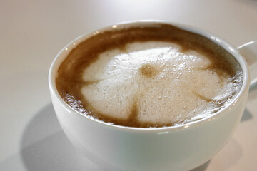cup of hot latte art coffee