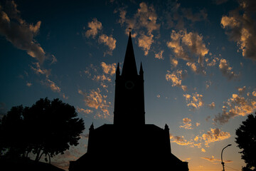 Obraz premium church tower at sunset