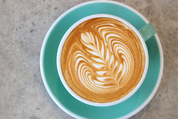 cup of hot latte art coffee