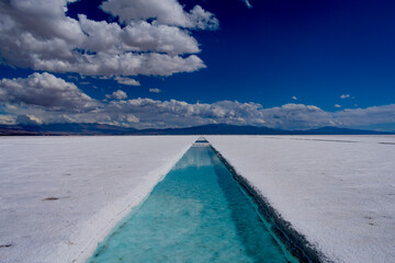 crystal clear water channel in the salar