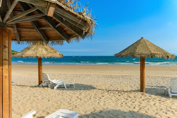 sun loungers and shelters on a beach