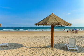 sun loungers and shelters on a beach