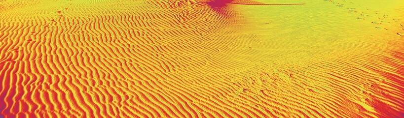 Sand ripples caused by the wind with vivid colors Yellow and red