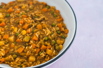 plant-based food, vegan stew with garden vegetables rice and cajun spices