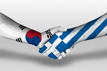 Handshake between greece and south korea flags painted on hands, illustration with clipping...