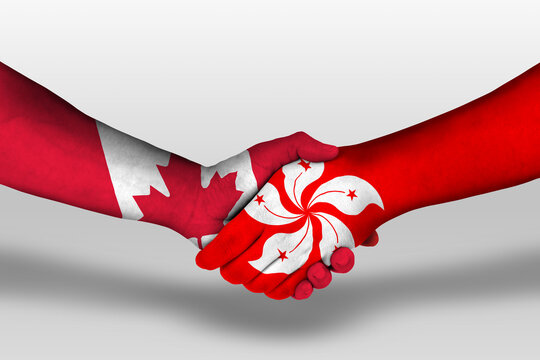 Handshake between hong kong and canada flags painted on hands, illustration with clipping path.