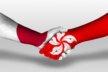 Handshake between hong kong and japan flags painted on hands, illustration with clipping path.