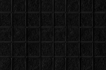 Black stone block wall seamless background and pattern texture