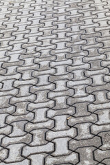 a road made of concrete tiles for pedestrian