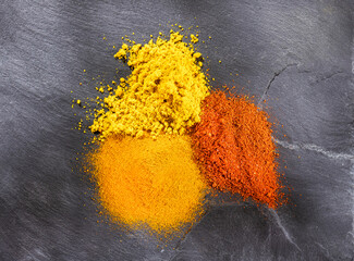 Turmeric, curry and paprika spice set. Text space