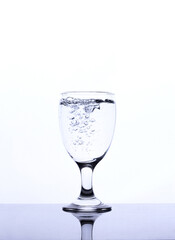 mineral water in a glass isolated white background