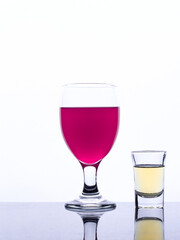 colored drink in a glass isolated white background