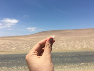 hand holding a spoon