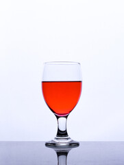 colored drink in a glass isolated white background