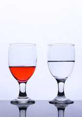 colored drink in a glass isolated white background