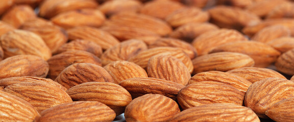 Background from the nuts of almonds, selective focus.