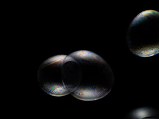 Soap bubble on black background