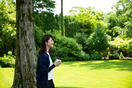 Mature Woman Relaxing in the Garden