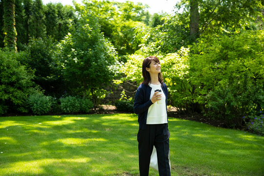 Mature Woman Walking in the Garden