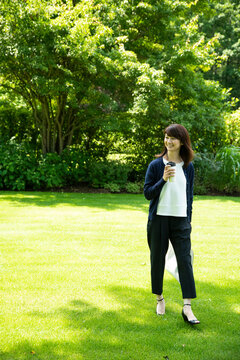 Mature Woman Walking in the Garden