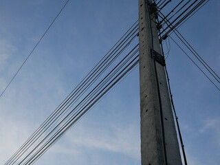 electric pole with wires in the sky.