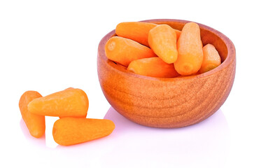 Carrot in wooden bowl isolated on white background.