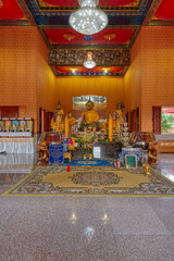 Samut Prakan / Thailand / June 7, 2020 : Wat Thum Ru, Really nice temple with some beautiful buildings and a strange collection of pop culture statues. Plus a dinosaur.