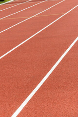 Fototapeta premium Red treadmill in sport field. Healthy and sporty lifestyles concept