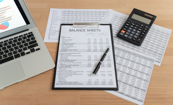 accaccounting report with financial statement on accountant desk. 