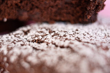 Delicious homemade brownies sprinkled with class sugar and stacked.