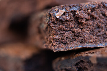 Delicious fluffy chocolate brownies stacked and in close up.