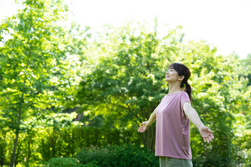 Woman Deep Breathing in Tender Green