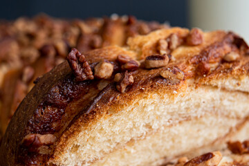 Delicious homemade walnut bread with sliced ​​walnuts pieces in close up.