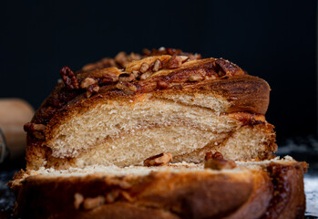 Delicious homemade walnut bread with sliced ​​walnuts pieces in close up.