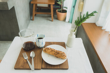 A cup of drip coffee and Croquet Choux 