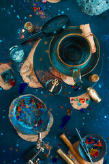 Astrology, astronomy concept with meteor, stars and scrolls on a starry night background