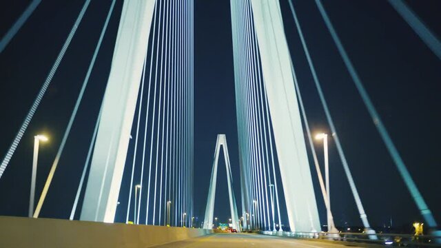 Driving on cinematic bridge at night