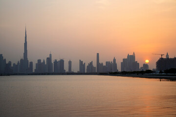 Fototapeta premium Sunset over a skyline of a beautiful city of Dubai. UAE.