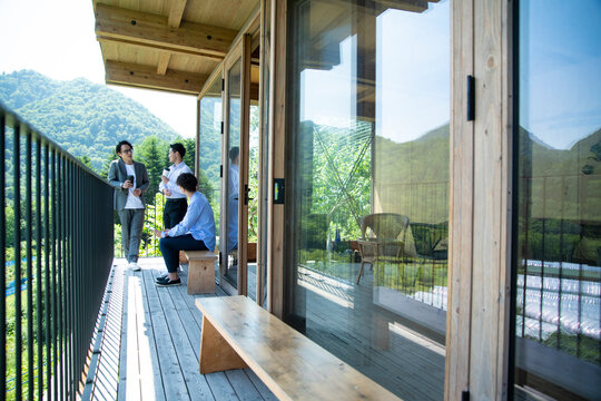 Businessmen Chitchatting on the Balcony