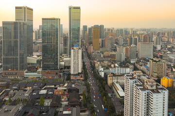 Chengdu, Sichuan Province, China - Nov 19, 2015: Skyline at dusk with IFS buildings and TaiKooLi in the foreground