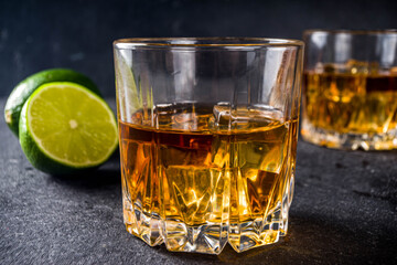 Whiskey with ice in glasses