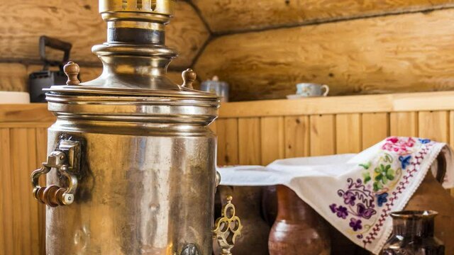 Antique samovar in the kitchen of a rural house in the national style.