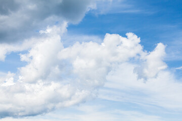 White clouds are in blue sky at daytime. Natural photo