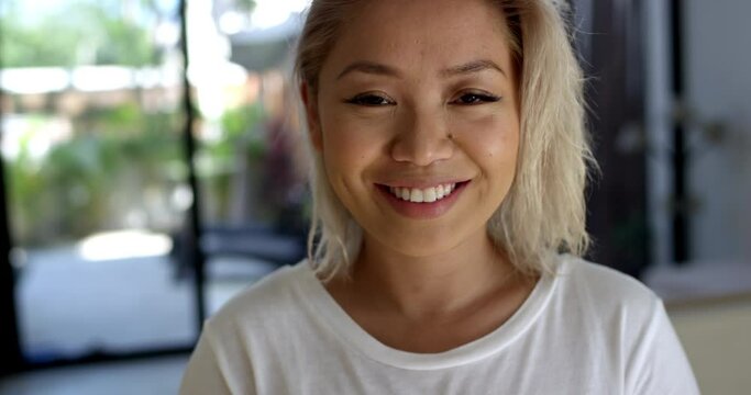 Portrait of young attractive woman first thing early in the morning smiling and happy to be on vacation 