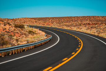 Desert highway at sunset, travel concept, USA. American roadtrip. Route 66.