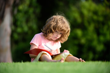 Little child boy drawing by pencil. Creative kid artistic, creativity early education and distance learning.