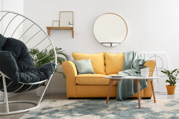 Interior of modern room with cozy sofa